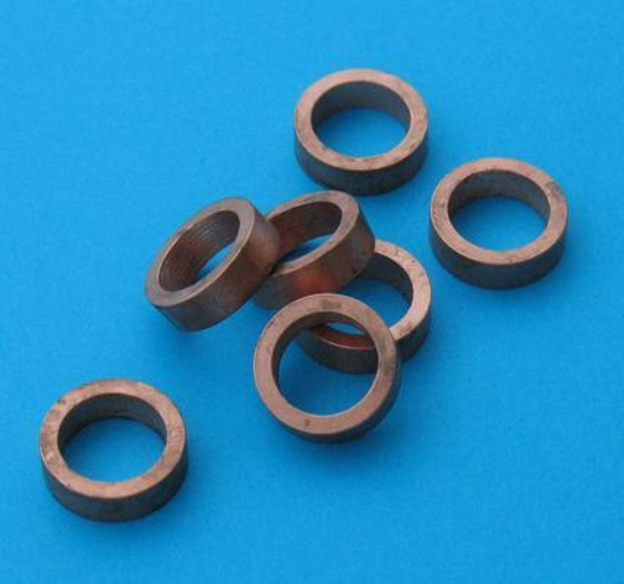 Spacer, for use with short bodied spark plug