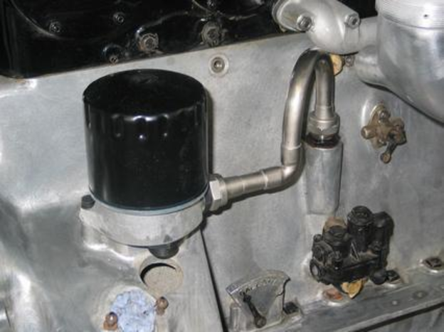 Oil filter installed on rear off-side of engine