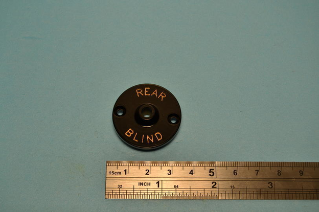 Bezel, dashboard switch, black egg shell finish, engraved, Rear blind